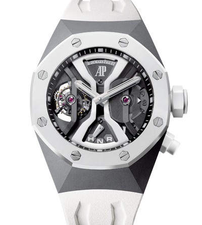 Audemars Piguet Royal Oak Concept GMT Tourbillon МЕХАНИЗМ Калибр 2930, мануфактурный с ручным подзаводом Общий диаметр : 35,60 мм (15 3/4 линии) Высота : 9,90 мм Количество камней : 29 Количество деталей : 291 Резерв хода : 237 часов Частота баланса : 3 Гц (21 600 полуколебаний/час) Обработка : мосты и платина ручной отделки, резные детали ручной отделки, полированные углы, окончательная обработка матовой поверхности выполнена вручную. КОРПУС Из титана Стекло и задняя крышка - сапфировые с антибликовым покрытием Белый керамический безель Заводная головка с винтовым стопором и белая керамическая кнопка Водонепроницаемость до 100 метров ЦИФЕРБЛАТ Скелетон Экран второго часового пояса на отметке « 3 часа » Указатель позиции заводной головки на отметке « 6 часов » Турбийон с мостом из черного анодированного алюминия на отметке « 9 часов » Стрелки Royal Oak из белого золота с люминесцентным покрытием Внутренний безель из черного анодированного алюминия РЕМЕШОК Белый каучуковый ремешок с раскладной застежкой AP из титана ФУНКЦИИ 24-часовой экран второго часового пояса Указатель дня и ночи Указатель выбранной функции Часы и минуты АРТИКУЛ 26580IO.OO.D010CA.01