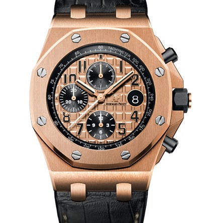 Audemars Piguet Royal Oak Offshore Chronograph 42 mm МЕХАНИЗМ Калибр 3126/3840, мануфактурный с автоматическим подзаводом Общий диаметр : 29,92 мм (13 1/4 линии) Высота : 7,16 мм Количество камней : 59 Количество деталей : 365 Резерв хода : 55 часов Частота баланса : 3 Гц (21 600 полуколебаний/час) КОРПУС Из розового золота 750-й пробы Стекло и задняя крышка сапфировые с антибликовым покрытием Заводная головка с винтовым стопором и кнопки из черной керамики Водонепроницаемость до 100 метров ЦИФЕРБЛАТ Цвета розового золота с узором Mega Tapisserie Черные счетчики Черные арабские цифры с люминесцентным покрытием Стрелки Royal Oak из розового золота с люминесцентным покрытием Черный внутренний безель РЕМЕШОК Прошитый вручную, из кожи аллигатора с широкими квадратными чешуйками, черного цвета, с пряжкой из розового золота 750-й пробы ФУНКЦИИ Хронограф (60-секундная стрелка в центре, 30-минутный и 12-часовой счетчики) Часы Минуты Секунды (малый циферблат) Дата АРТИКУЛ 26470OR.OO.A002CR.01