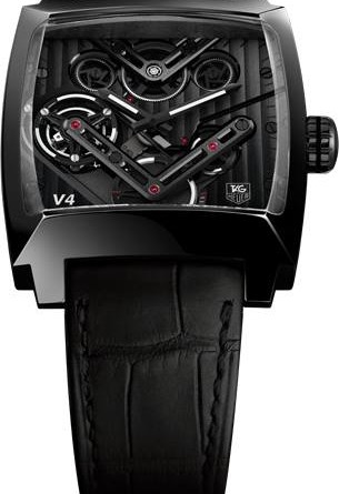 TAG Heuer MONACO V4 TOURBILLON. МЕХАНИЗМ: 214 детали Размеры: 31,5 мм х 35 мм х 9,26 мм. Турбийон 28 800 полуколебаний в час / 4 гц. Одноминутный турбийон (1 вращение в минуту). 46 камней. Запас хода - 40 часов. Индикация функций: Часы, Минуты, Малая секундная стрелка в положении «6 часов» на втором колесе. Характеристики механизма: 4 зубчатых ремня: Толщина самого тонкого ремня: 0,07 мм, 2 ремня со внутренним стальным кордом для придания жесткости, 2 пары соединенных ремнем барабанов, расположеннх параллельно друг другу и наклоненных под углом 13°. Система распределения усилий на основе микрошестеренки в положении «12 часов». Линейный ротор с двойным зубчатым рельсом, вольфрамовый брусок, 9 микрошестеренок. ЦИФЕРБЛАТ: Турбийон на ременном приводе в положении «9 часов». 2 стальных V-образых моста с черным покрытием, матовой отделкой и отполированными вручную фасками, 3 моста с черным покрытием и нанесенным вручную узором «Côtes de Genève» высокого часового искусства. Граненые часовая и минутная стрелки с черным и белым люминесцентным покрытием. Белая гравировка логотипа TAG Heuer в положении «5 часов». Белая гравировка «V4» в положении «7 часов». КОРПУС: Полированный корпус из титана 5 с черным титан-карбидным покрытием. Размер: 41 x 41 мм. Сапфировое стекло с фасками с двухсторонним антибликовым покрытием для обеспечения оптимальной считываемости показателей. Задняя стенка из сапфирового стекла из 3 секций. Водонепроницаемость: 50 метров. РЕМЕШОК: Ремешок из мягкой черной кожи аллигатора с ручной прошивкой. Раскладывающаяся застежка с кнопками блокировки из титана 5 с черным титаново-карбидным покрытием и логотипом V4.